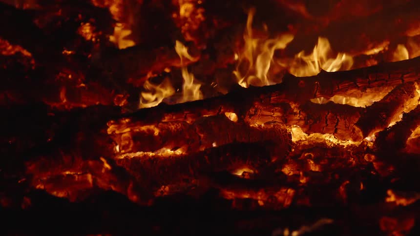 The wood is burning at night