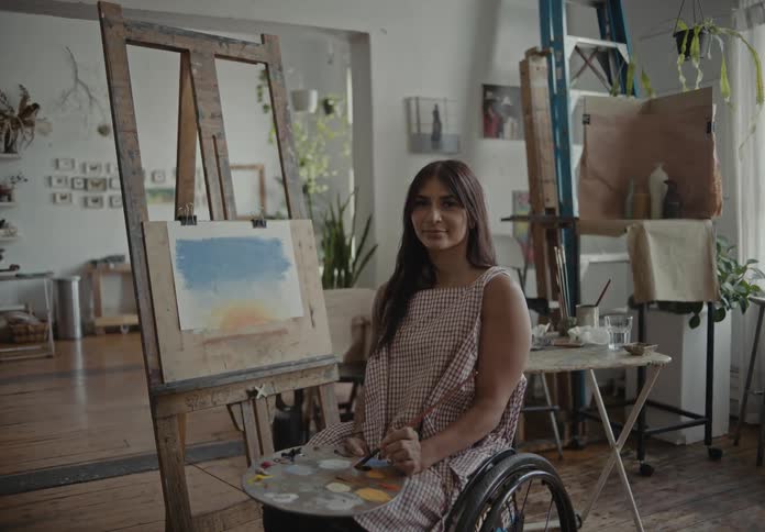 An artist painting a modern art canvas