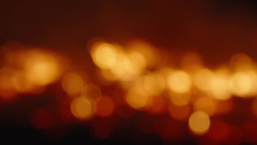Flames of a large bonfire lit at night