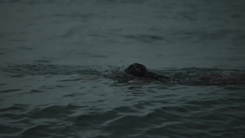 A clip of a person swimming the sea