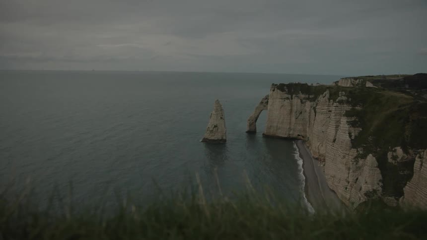 Aerial of a hillside at the beach during a cloudy day