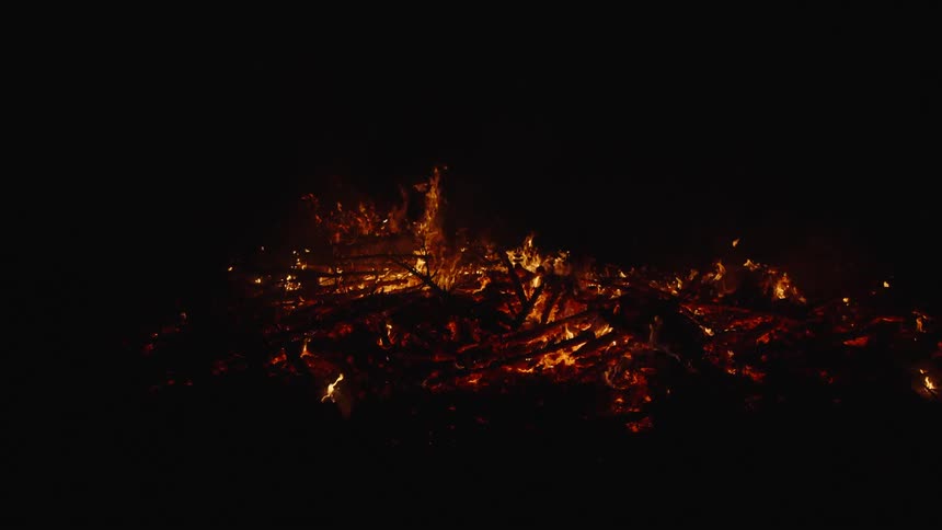 View of wood being burned at night in slow motion