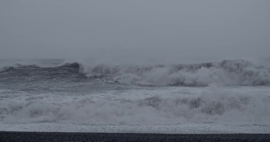 Ocean waves wash ashore a beach