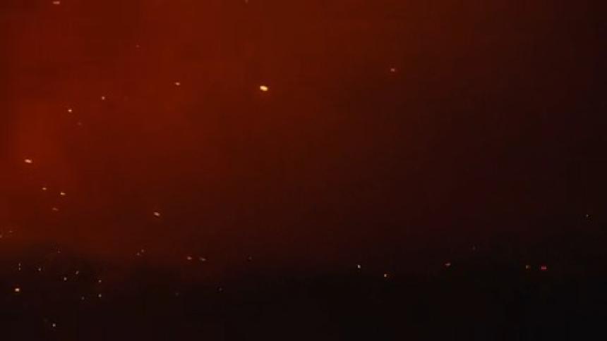 Smoke from a cloudy fire at night