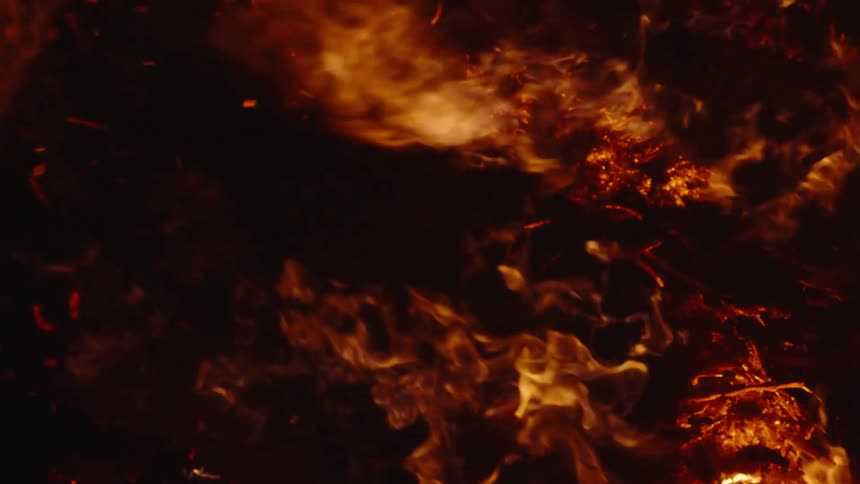 Burning wood on a bonfire at night