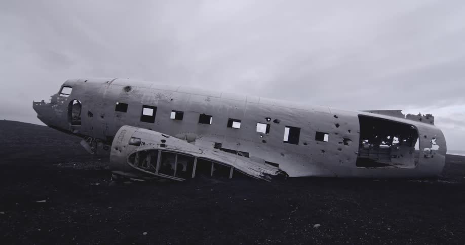 Wreckage of an airplane lays in a field