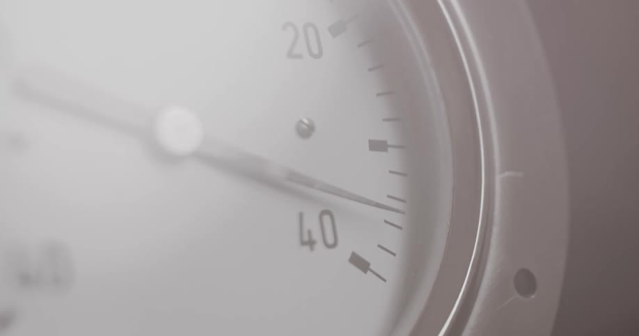 A pressure gauge indicating rapidly rising pressure