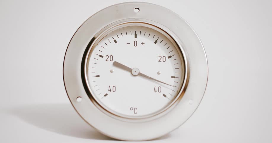 Needle on roundthermometer moves toward 40c