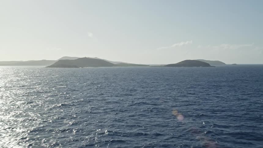 Aerial view ocean and islets on horizon