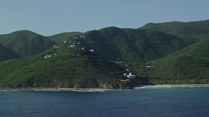 Aerial view green vegetation covered hillside coastline and ocean