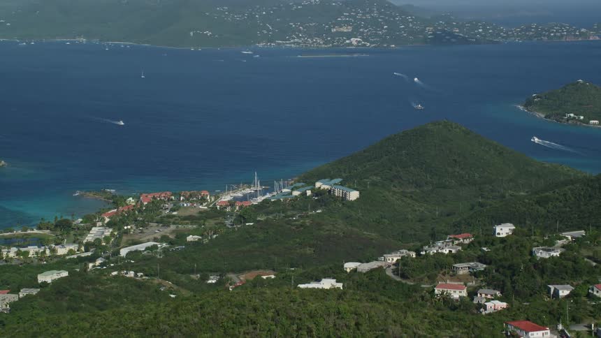 Aerial view of boats traveling between tropical islands
