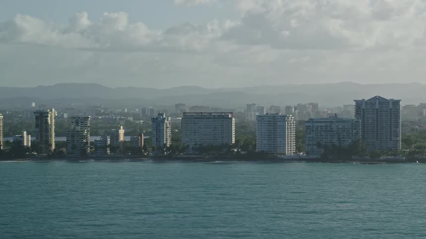 An aerial view of a city with buildings along the coast