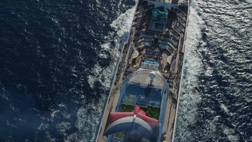 An aerial view of a cruise ship out on the ocean