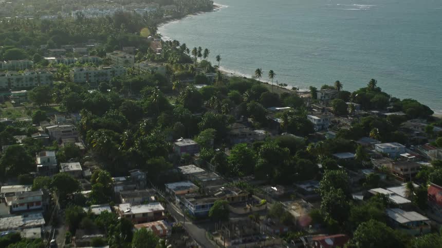 An aerial view of the coast with the ocean next to it