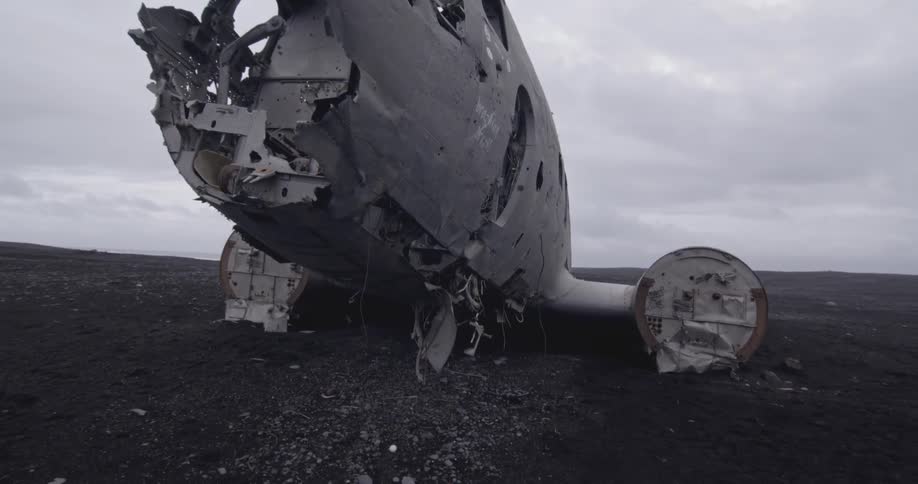 Airplane wreckage lays abandoned in a field