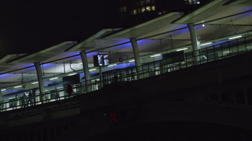 A train station in the urban city at night