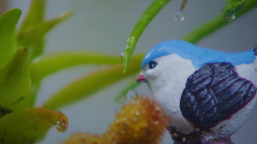 Porcelain sculpture of a bird in a garden