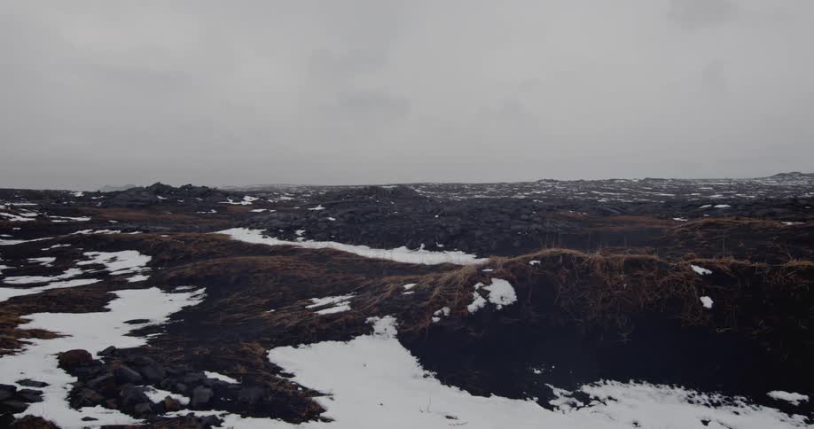 A snowy rock terrain on an overcast day