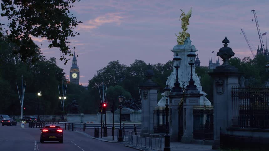 View of a street amidst a memorial statue on a day with a purple sky