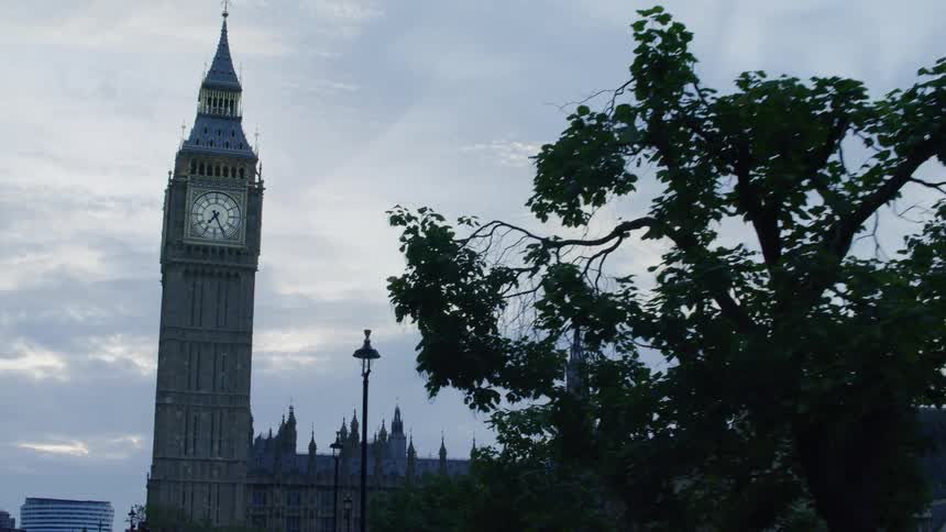 Public street with the big ben in london on a cloudy morning