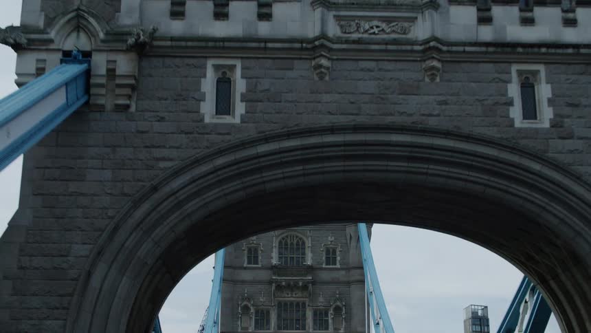 Traffic moves over an ornate city bridge