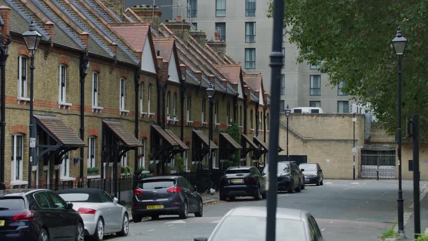 Cars parked on street in front of buildings during the day