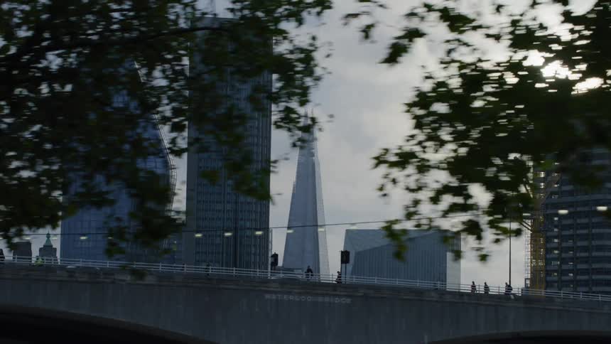 Skyline of a metropolitan city with glass skyscrapers on a cloudy day
