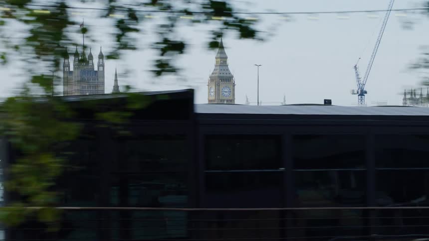 Buses travel over the bridge in the city