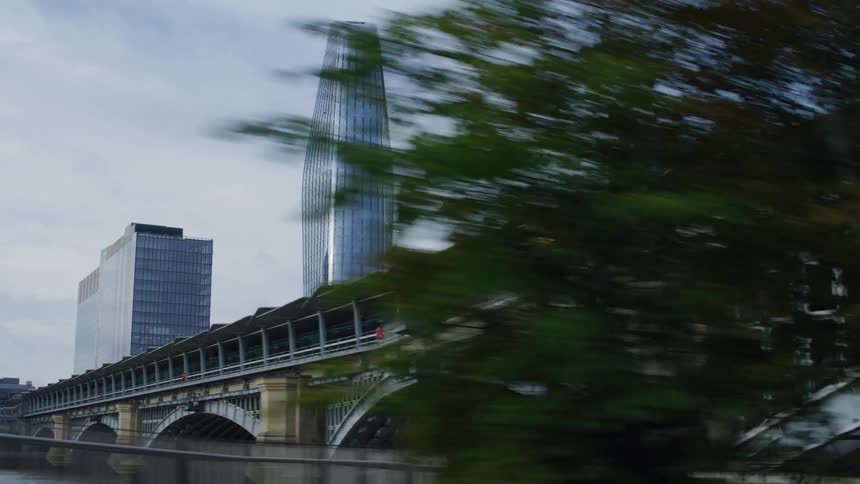 A clip ofa bridge and skyscrapers in the city