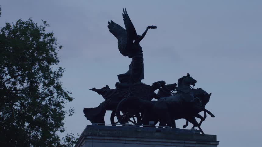 A statue of angels riding a horse chariot