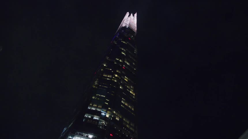 A skyscraper looms over a city