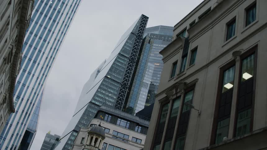 Alley in a metropolis with buildings and skyscrapers on a cloudy day