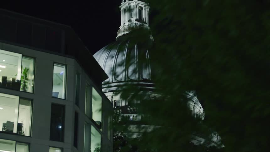 Night view of a huge sleeps in a building in the middle of a metropolis