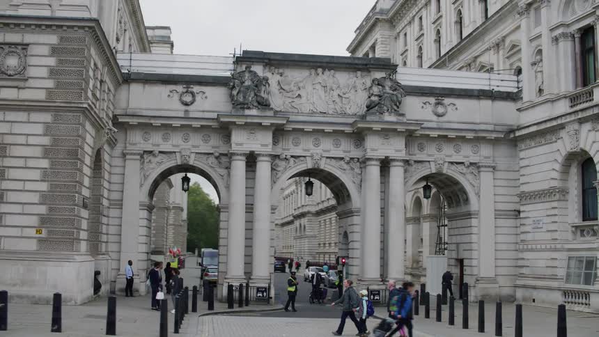 A classical style three arch gateway to a london street