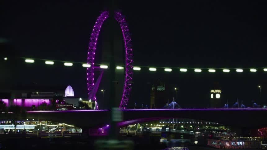 A night clip of a bus moving on a bridge
