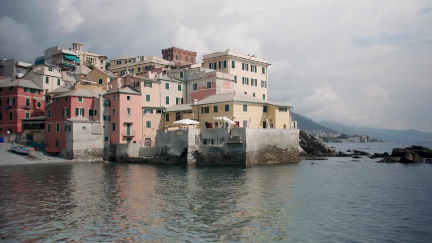 Many buildings grouped at the edge of a body of water