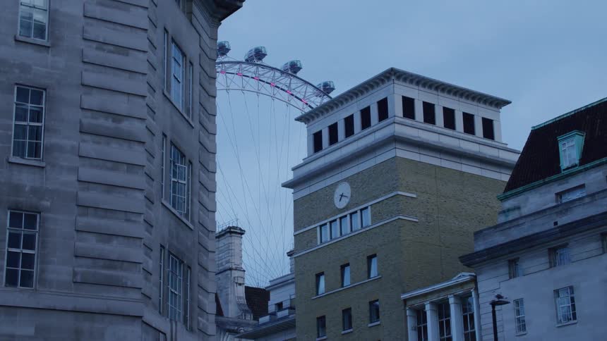 A large ferris wheel is in the city