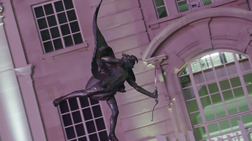 A statue of an archer in the street