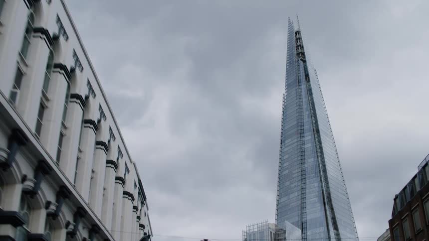 Upward view of the shard london bridge on a cloudy day