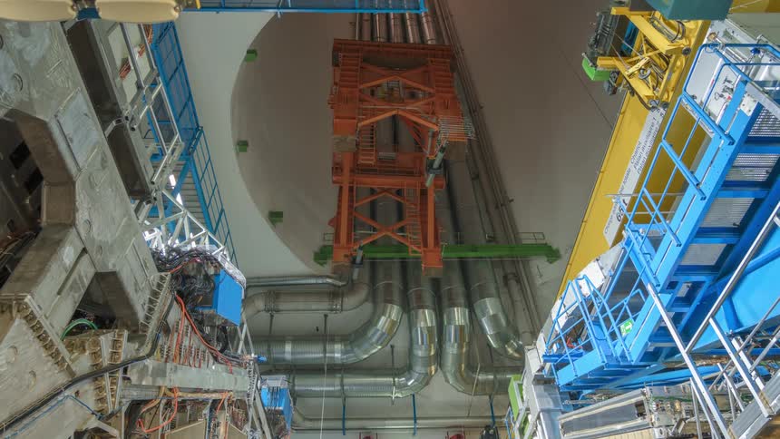 Orange structure rises into large shaft lined with large ducts