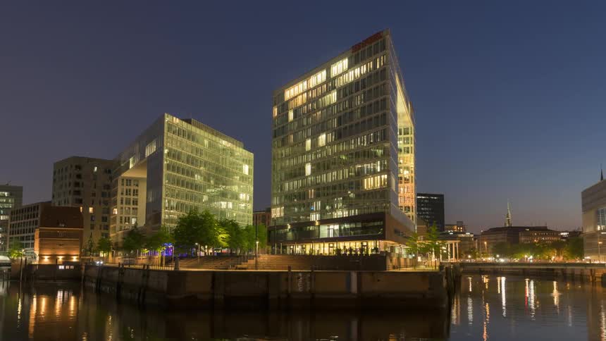 Glass buildings in front of the city canal