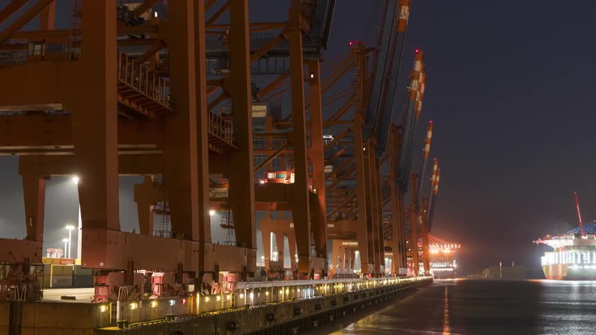 A river runs next to a shipyard