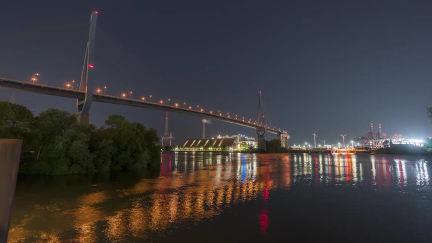 A bridge over water near buildings