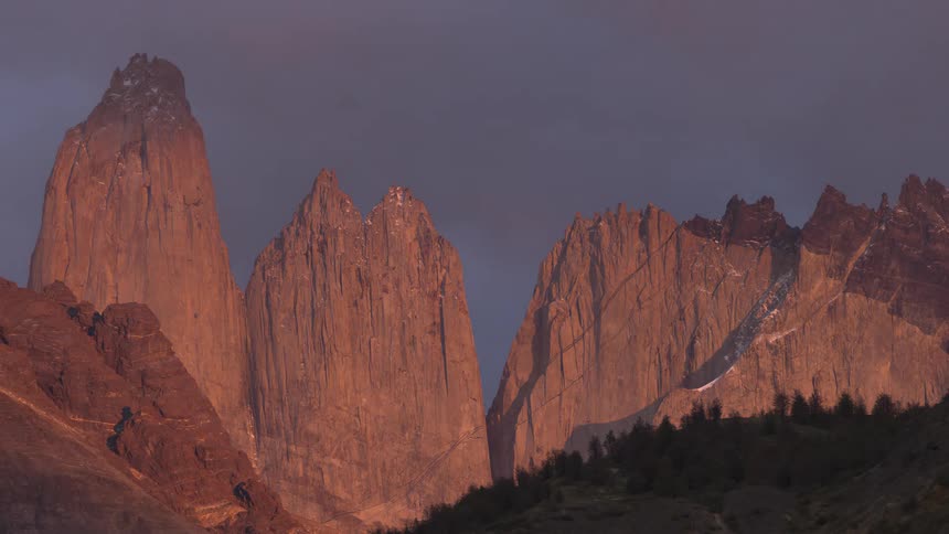 A timelapse of a sunset over a mountain range