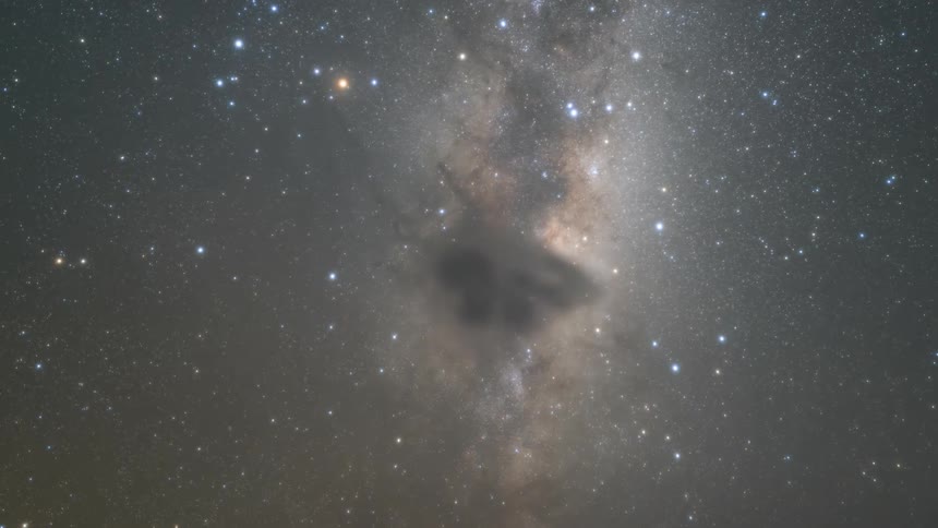 tracking shot of the nightsky with stars and nebulae in timelapse