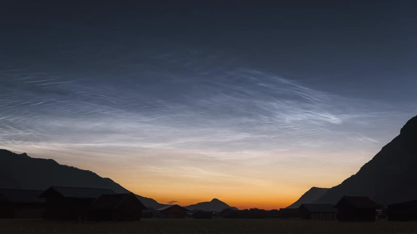 Strong Noctilucent Clouds (NLC's) above a rural mountain area