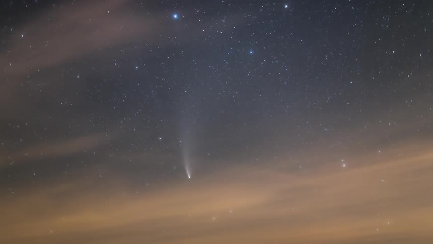 A comet with stars and clouds