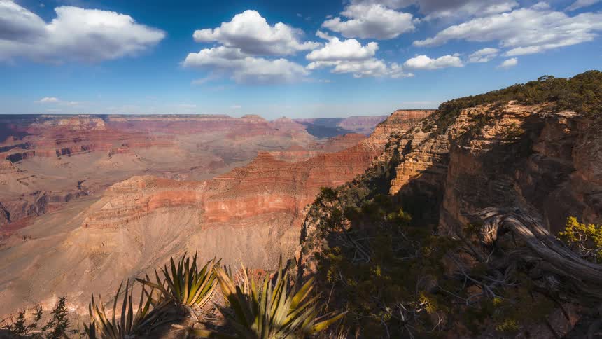 Natural panorama of canyons geological formations on a day with sky with clouds in timelapse