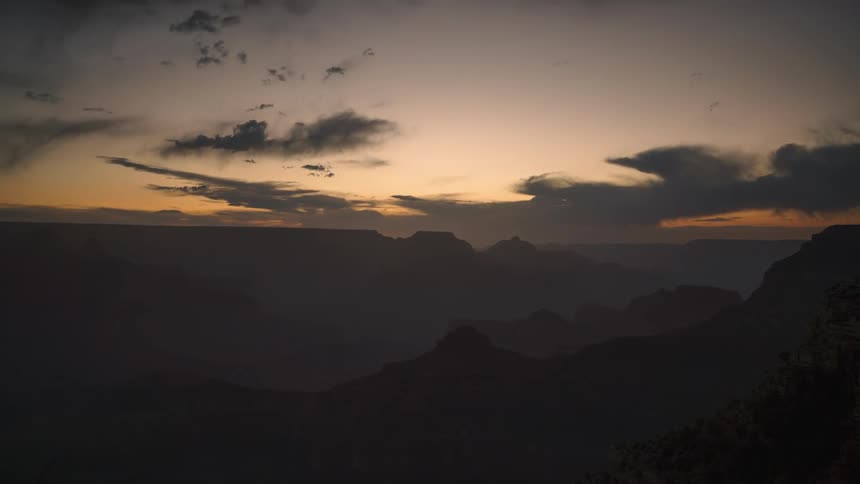 Aerial of a mountain range during cloudy dawn