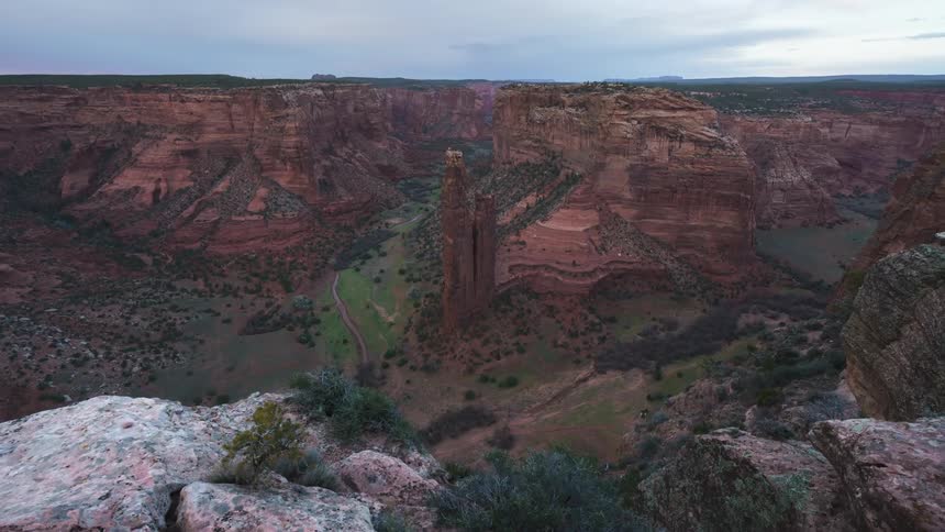 Aerial panorama of mountain ranges and canyons with vegetation on a morning